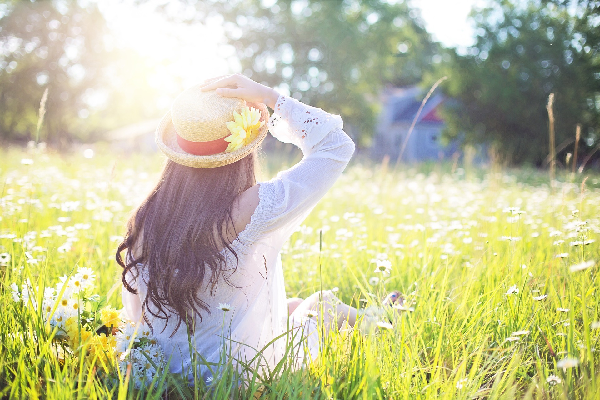 woman sitting in grass - Menopause Facts vs. Myths: Your Essential Guide!