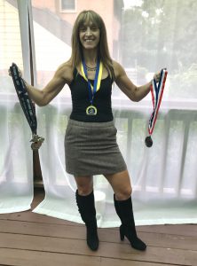 Interview With The Ultra Runner - holding all medals up 