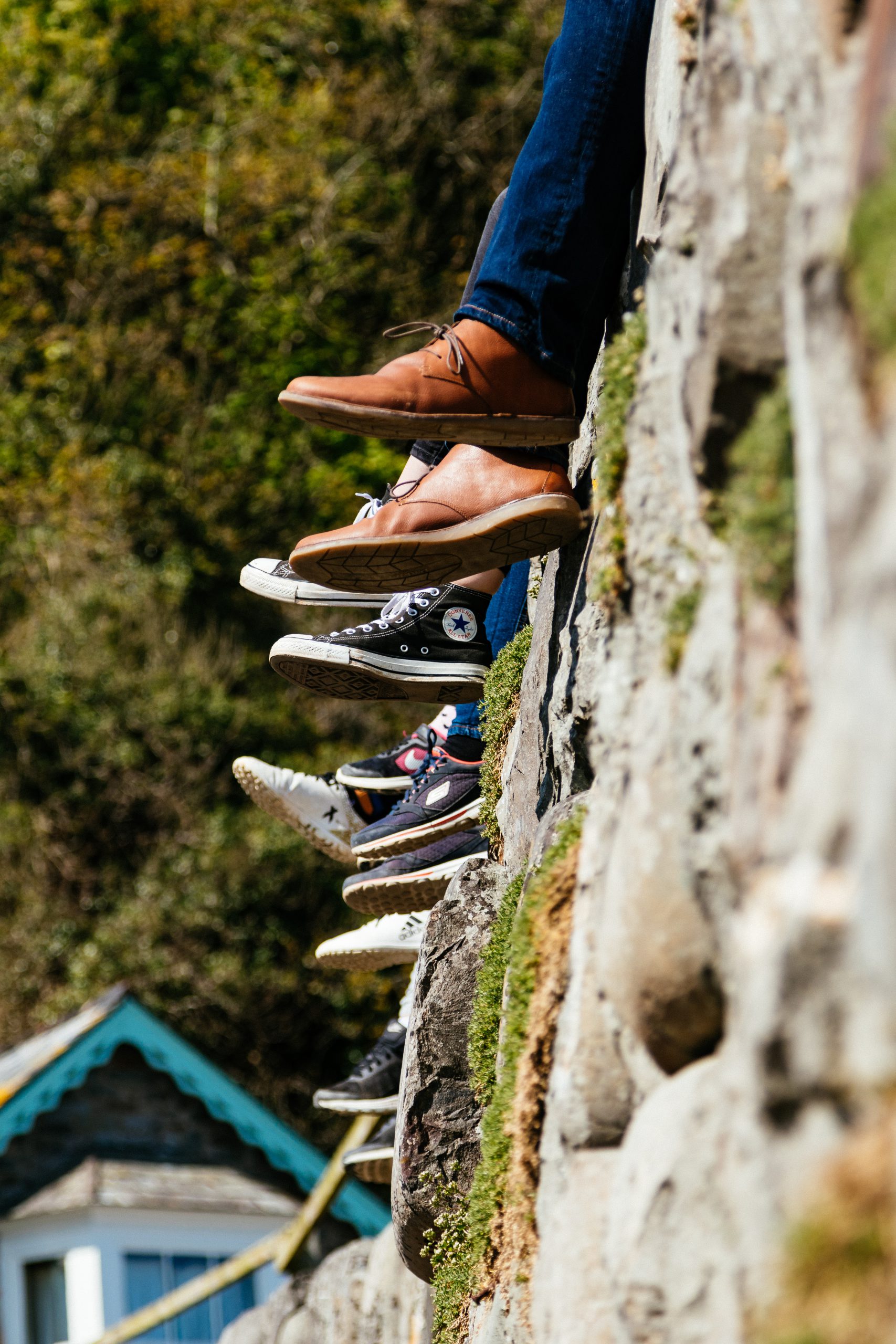 Different kinds of sneakers on a wall -What's The Best Sneaker For Different Kinds Of Exercise?