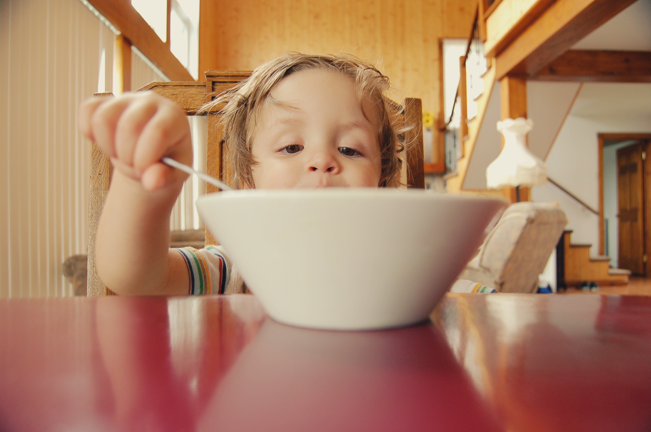 kid eating out of a bowl   - 6 Common Mistakes During Intermittent Fasting