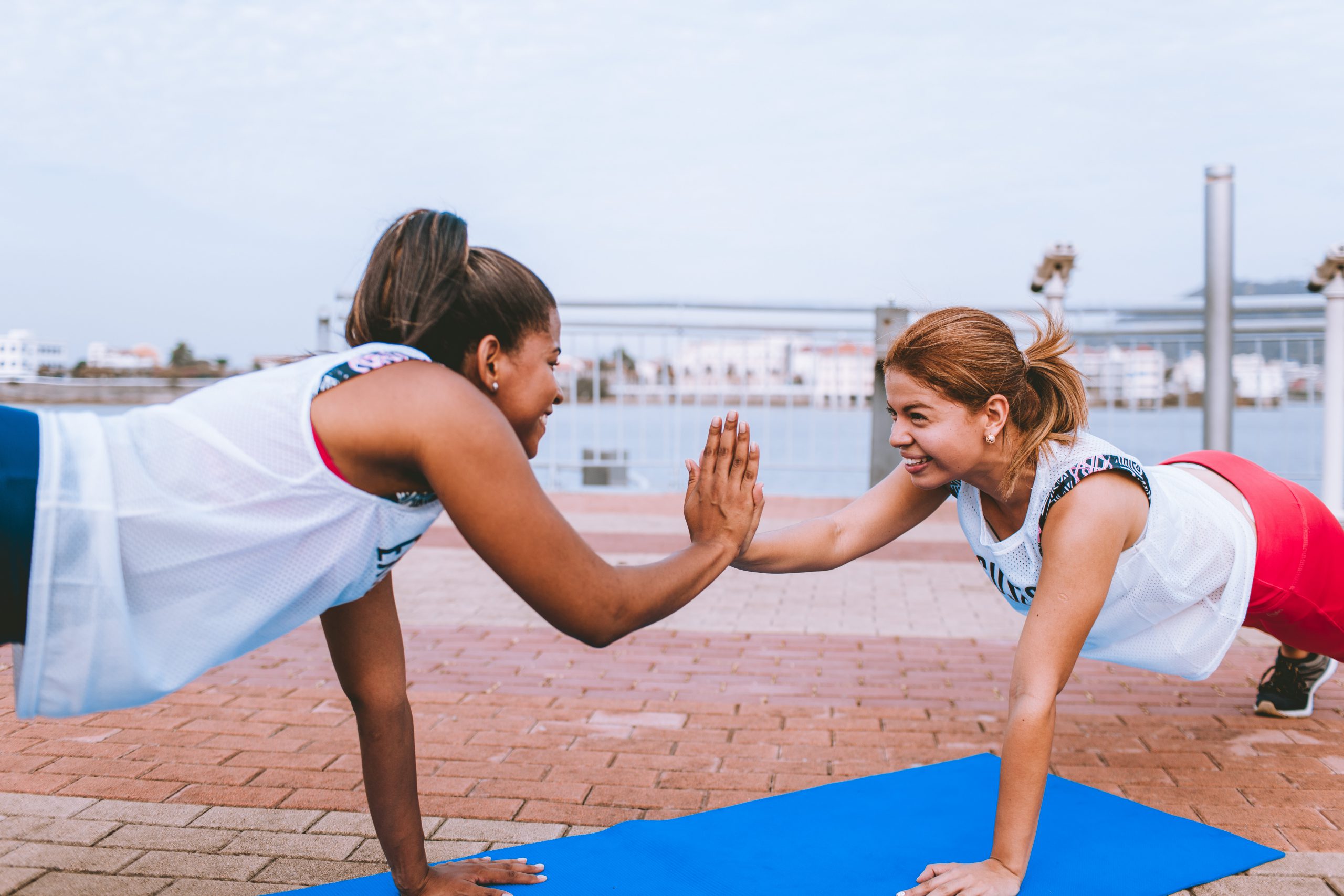 How to Get Motivated to Exercise When You Don’t Like It - two women high five