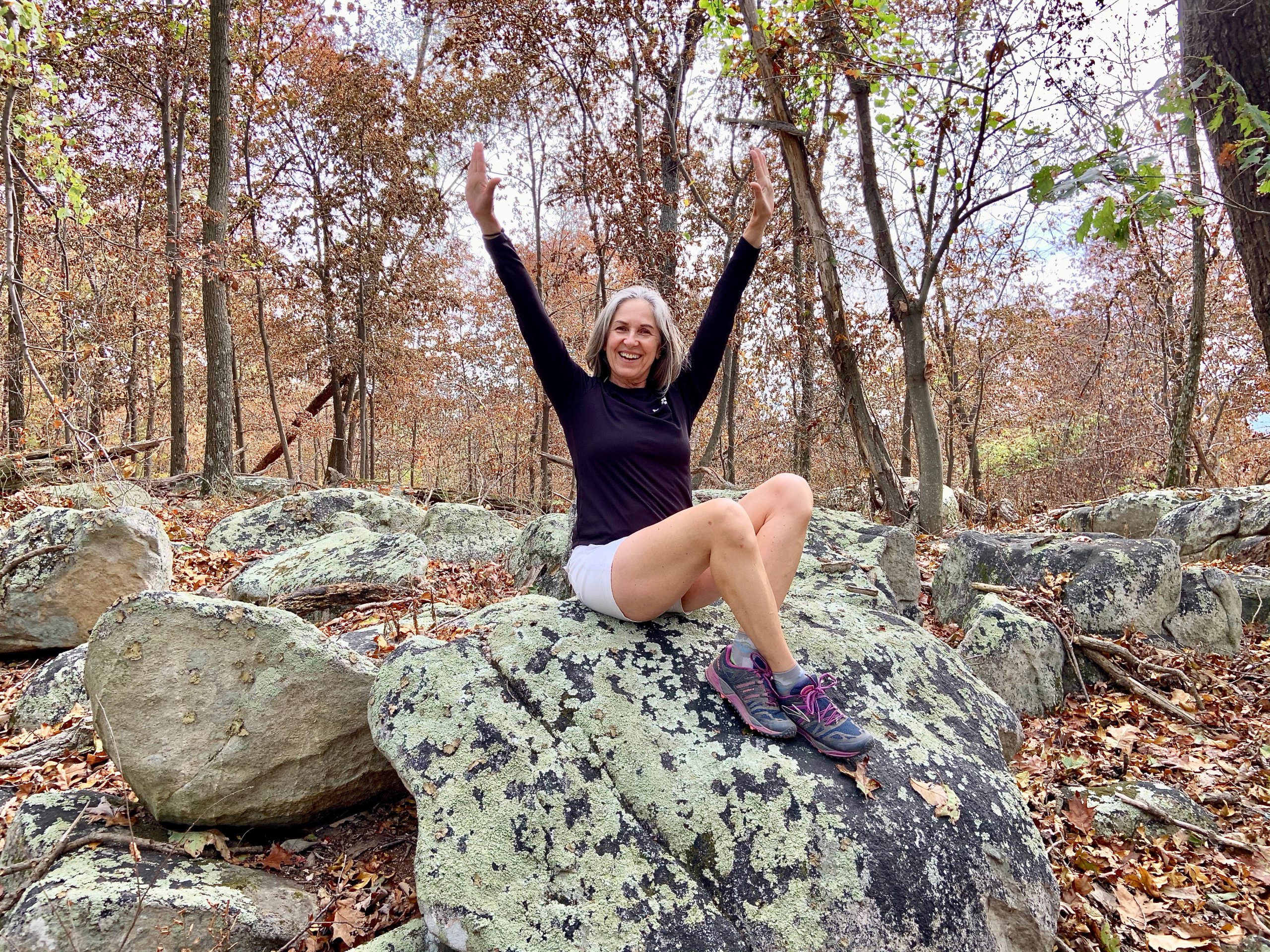 women sitting on a rock - 3 Essential Steps To Boost Self-Confidence