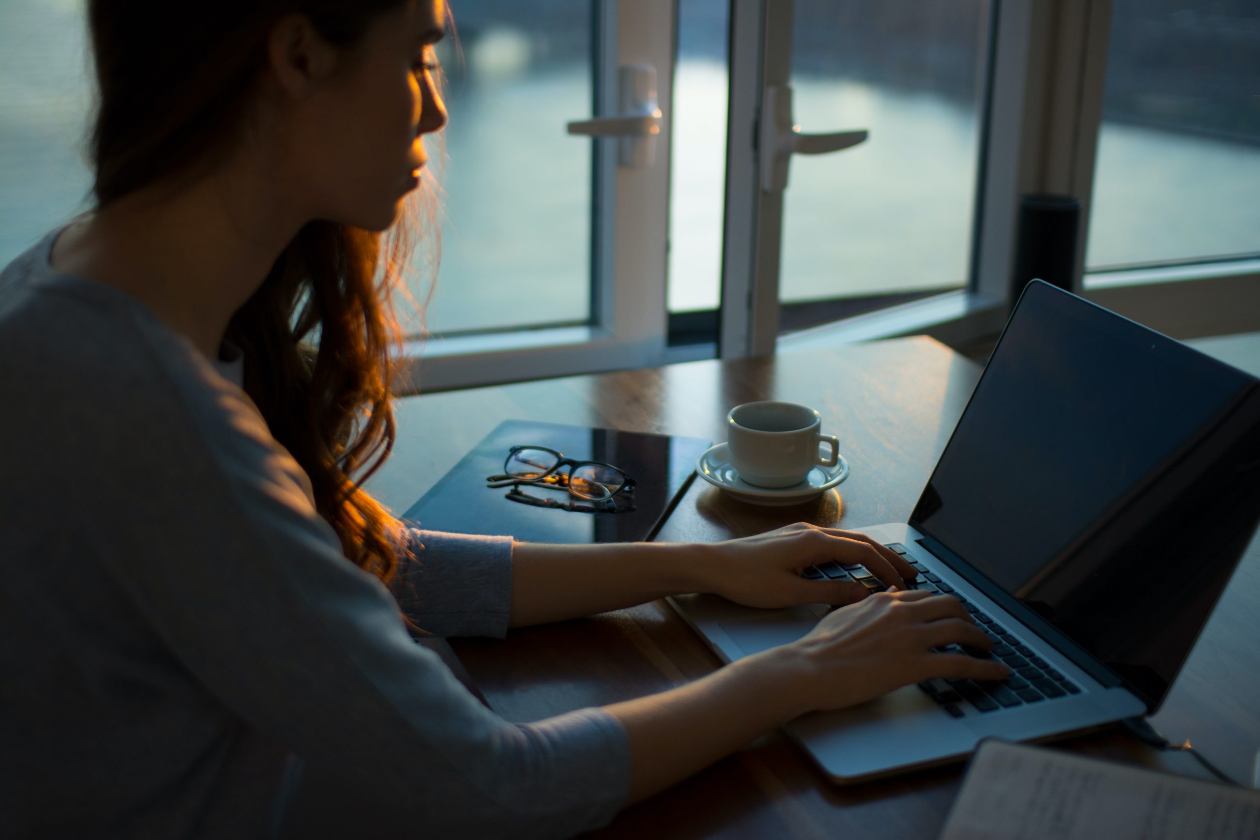 woman working on laptop -5 Mistakes To Avoid When Working From Home