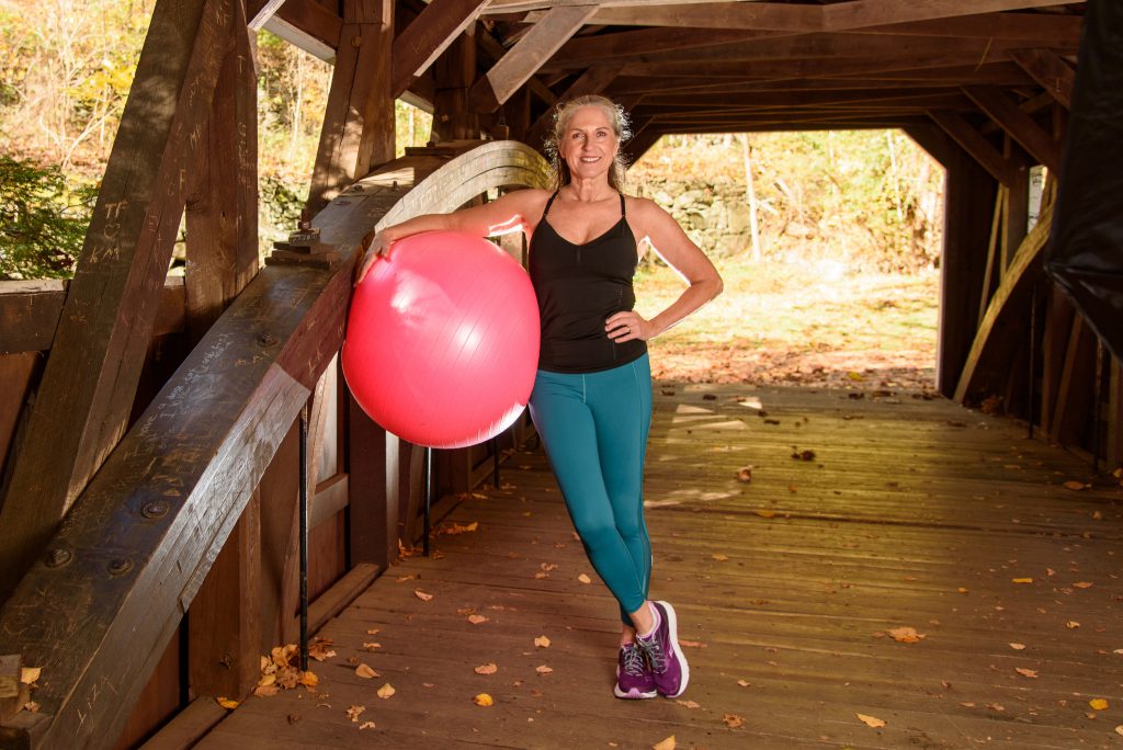 Heike Yates midlife fitness expert and confidence coach with using the stability ball