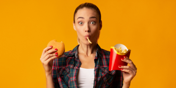 woman eating fast food - heike yates
