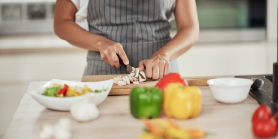 Woman chopping vegtables - 5 Easy Meal Prep Ideas For Beginners - heike yates