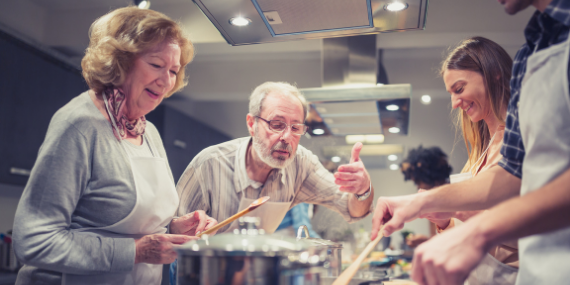 Couple taking cooking class - 5 Strategies To Plan For Your Almost Empty Nest - heike yates