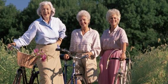 women outdoors biking - Let’s disrupt ageism in the health and fitness industry - heike yates