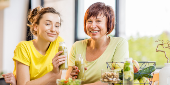 friends drinking green juice - Heike Yates