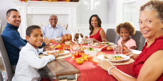 family sitting at the holiday dinner table
