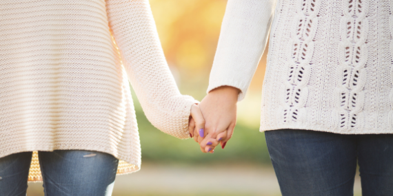 couple holding hands - 3 Tips To Stop Comparing Yourself To Other Women - heike yates
