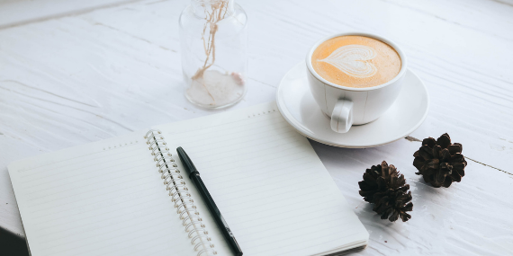 journal and coffee cup - effective ways to stop comparing yourself to other women - Heike yates
