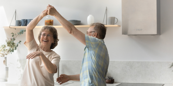 couple dancing in the kitchen -5 Strategies To Help You To Get Unstuck In Your Empty Nest - heike yates 
