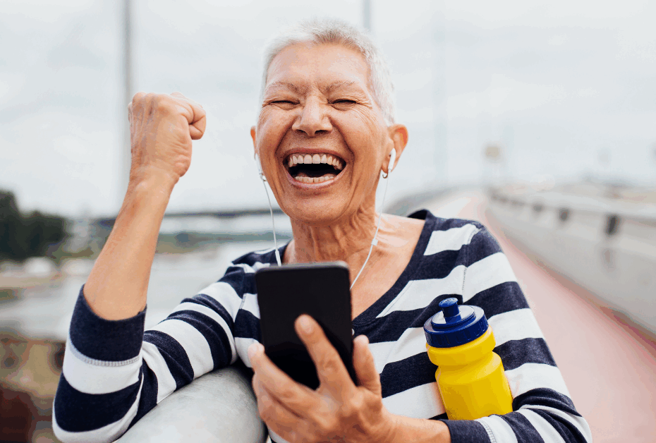 Woman in midlife cheering for herself. 5 ways to love your body in midlife.