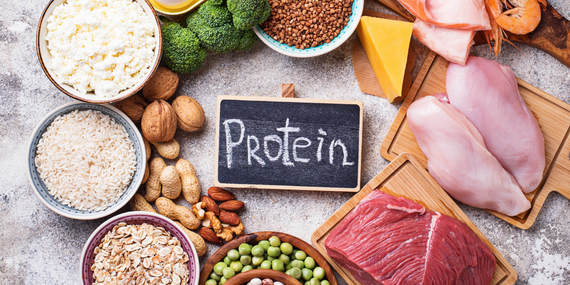 4 Health Benefits Of Protein For Women Over 50 - sign with protein and lots of protein around it
