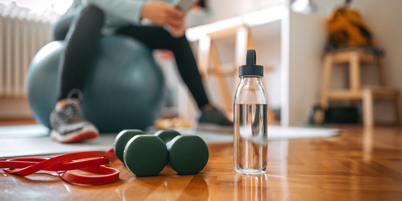 workout space set up with weights, ball and water bottle - Heike Yates