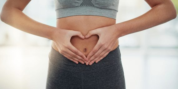 5 Ways Resistant Starch Impacts Your Health - woman making a heart on her stomach