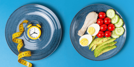 Plate with food and plate with clock and measure tape. 8 Ways To Get The Best Results From Intermittent Fasting Over 50