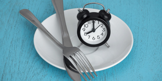 8 Ways To Get The Best Results From Intermittent Fasting Over 50 - plate, clock and fork and knife