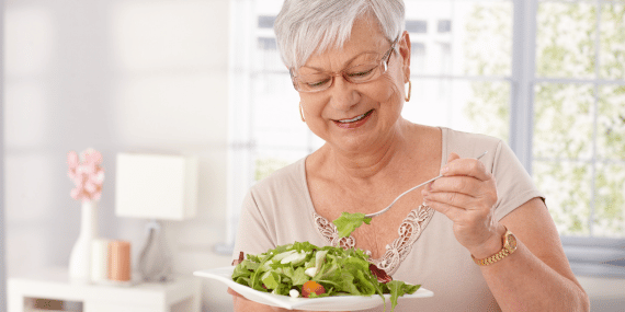 8 Ways To Get The Best Results From Intermittent Fasting Over 50 - woman eating salad