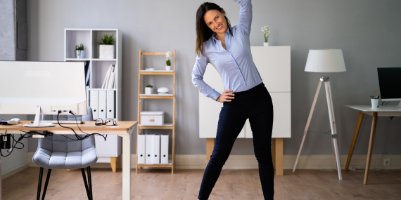 Top 5 Reasons Exercising Regularly Will Benefit Your Finances - woman stretching in office