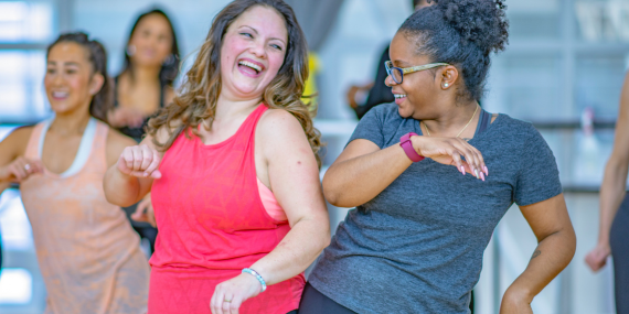 3 Ways To Recapture Your Health and Thrive In Midlife - two women having fun dancing 