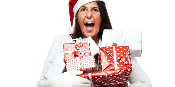 5 Tips To Escape Holiday Stress - woman screaming with gifts in hands