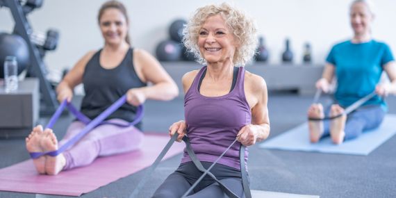 How To Stop Weight Gain Through Menopause - woman in an exercise class