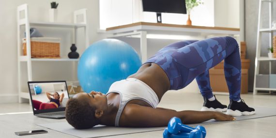 woman doing plank at home - 6 Powerful Ways to Boost Your Midlife Wellness