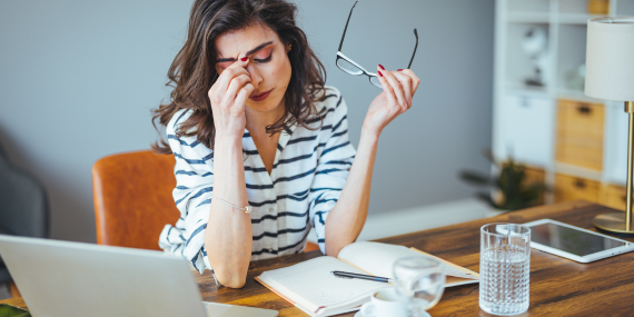 woman sitting at her desk stressed - 3 Ways To Transform Your Relationship With Alcohol