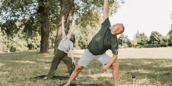 two people doing yoga