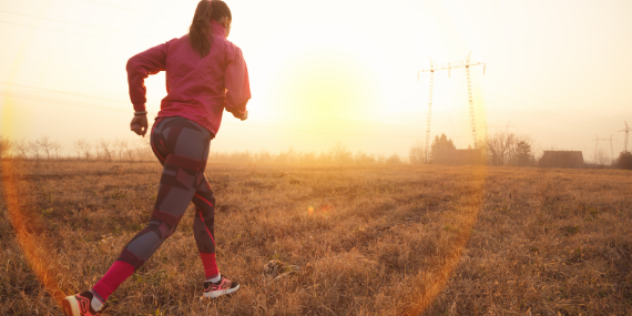Why Midlife Fitness Feels Hard (And How to Fix It) woman running in a field for midlife health
