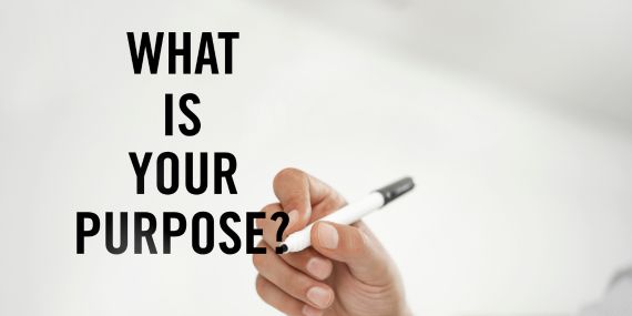 Someone writing: What is purpose? midlife, mindset, finding your purpose.  How to Build Confidence and STOP Putting Yourself Last