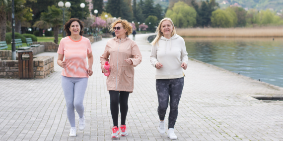 three women walking near a lake, fitness, midlife health, wellness,