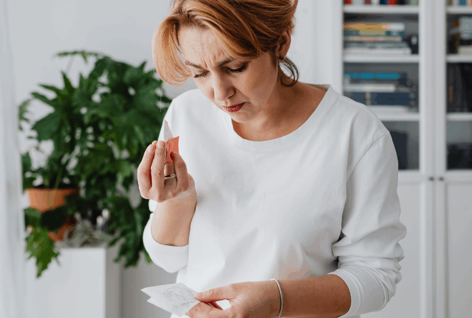 3 Ways To Stop Overthinking Everything in Midlife - midlife woman frustrated looking at notes