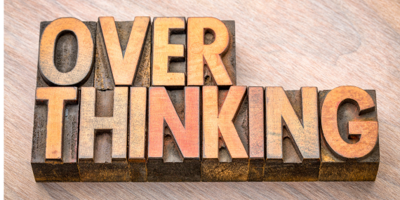 3 Ways To Stop Overthinking Everything in Midlife - a wooden sign saying overthinking