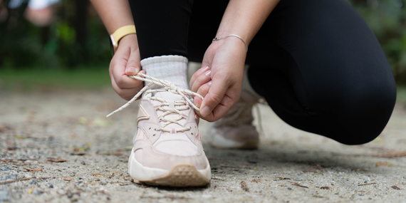 woman tying her running shoes.Building Consistency in Midlife: Why Speaking Up Still Leaves Women Feeling Small 
