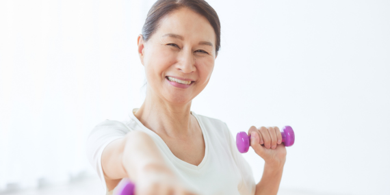 Woman embracing the midlife body disconnect by rebuilding confidence through healthy movement and self-care.