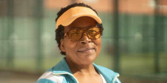 Strong midlife woman smiling into the camera feeling confident.