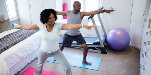 couple doing yoga as part of their fitness routine